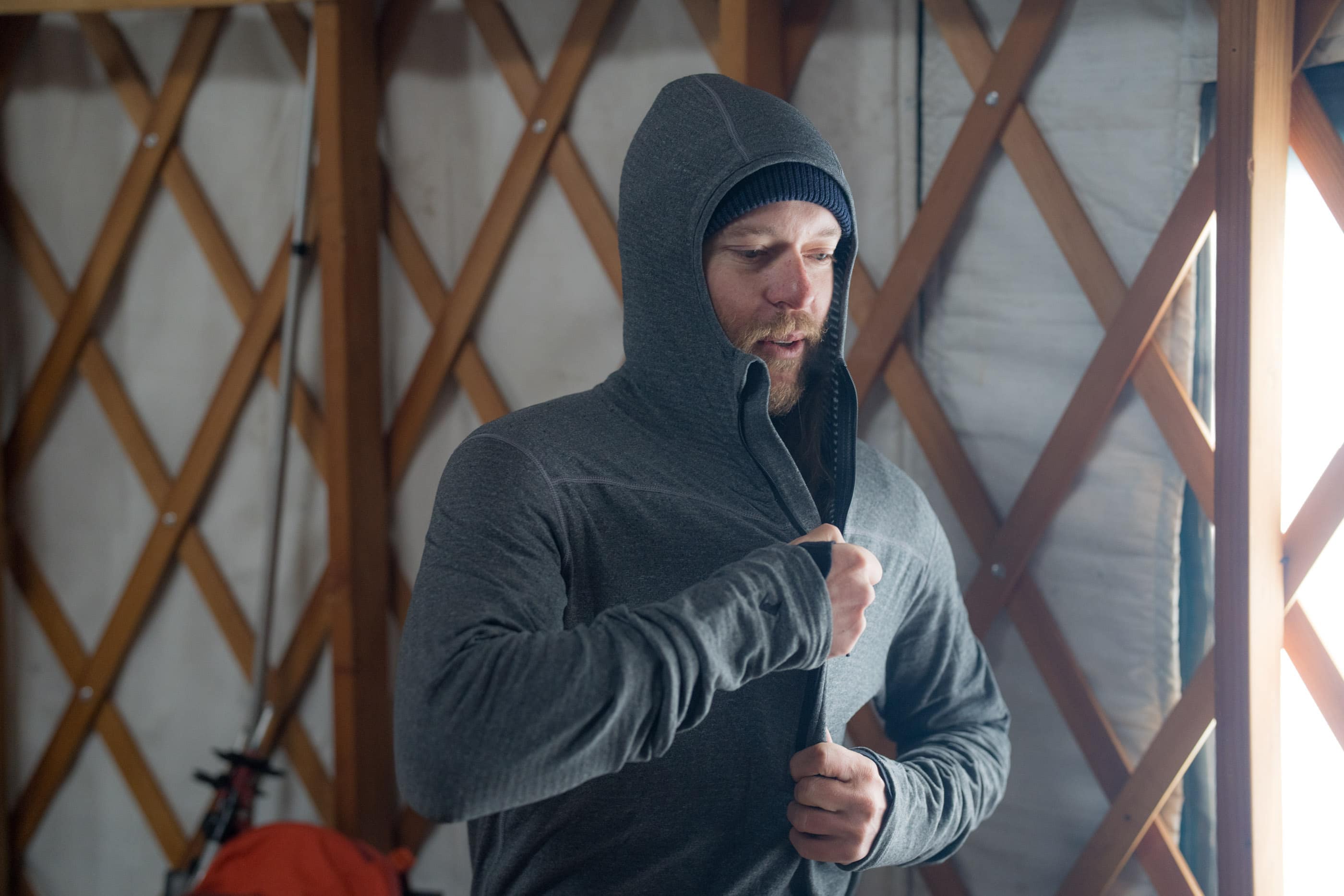 a man layers up in a Ridge Convict Canyon Hoodie
