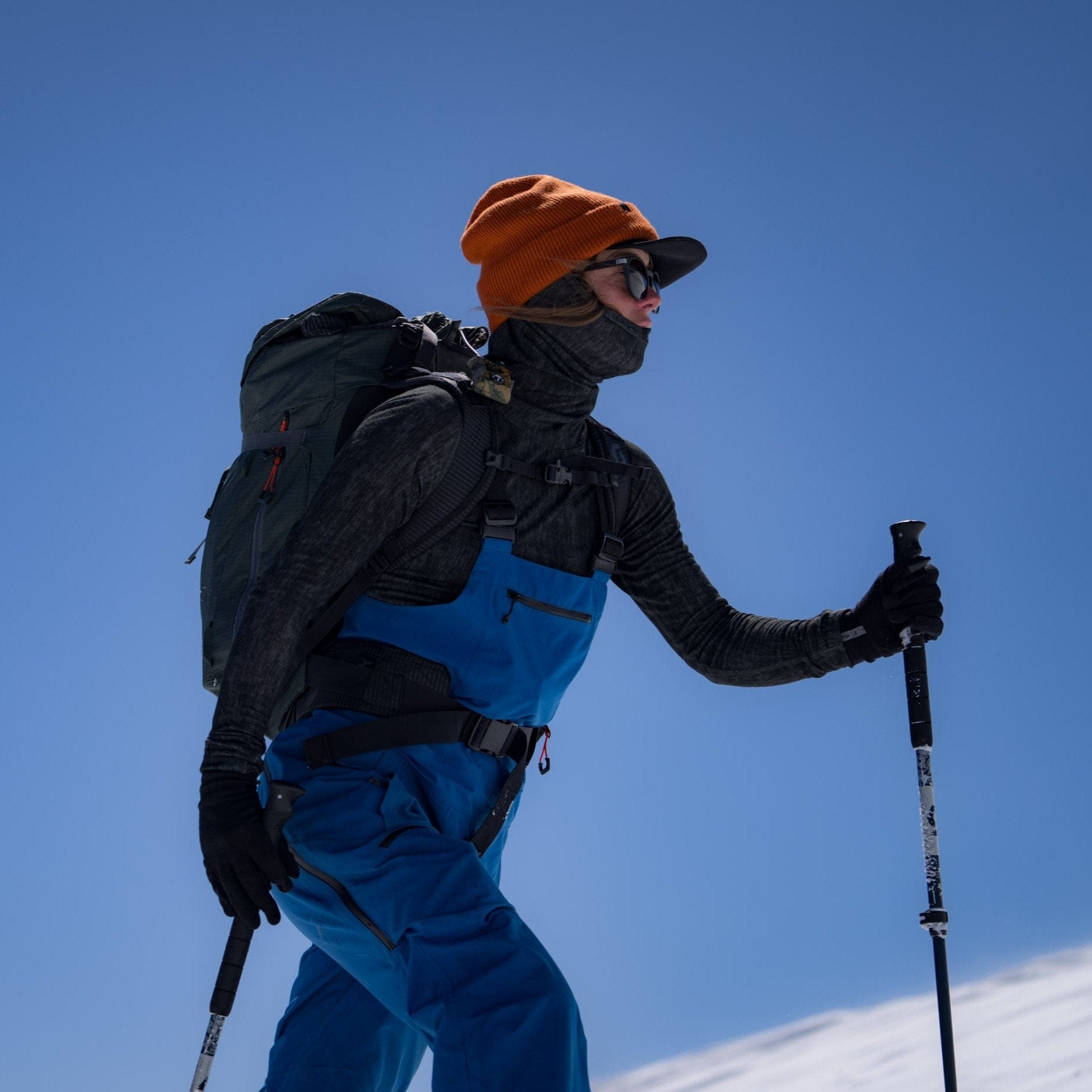 a woman wearing an Aspect high neck base layer top while skinning