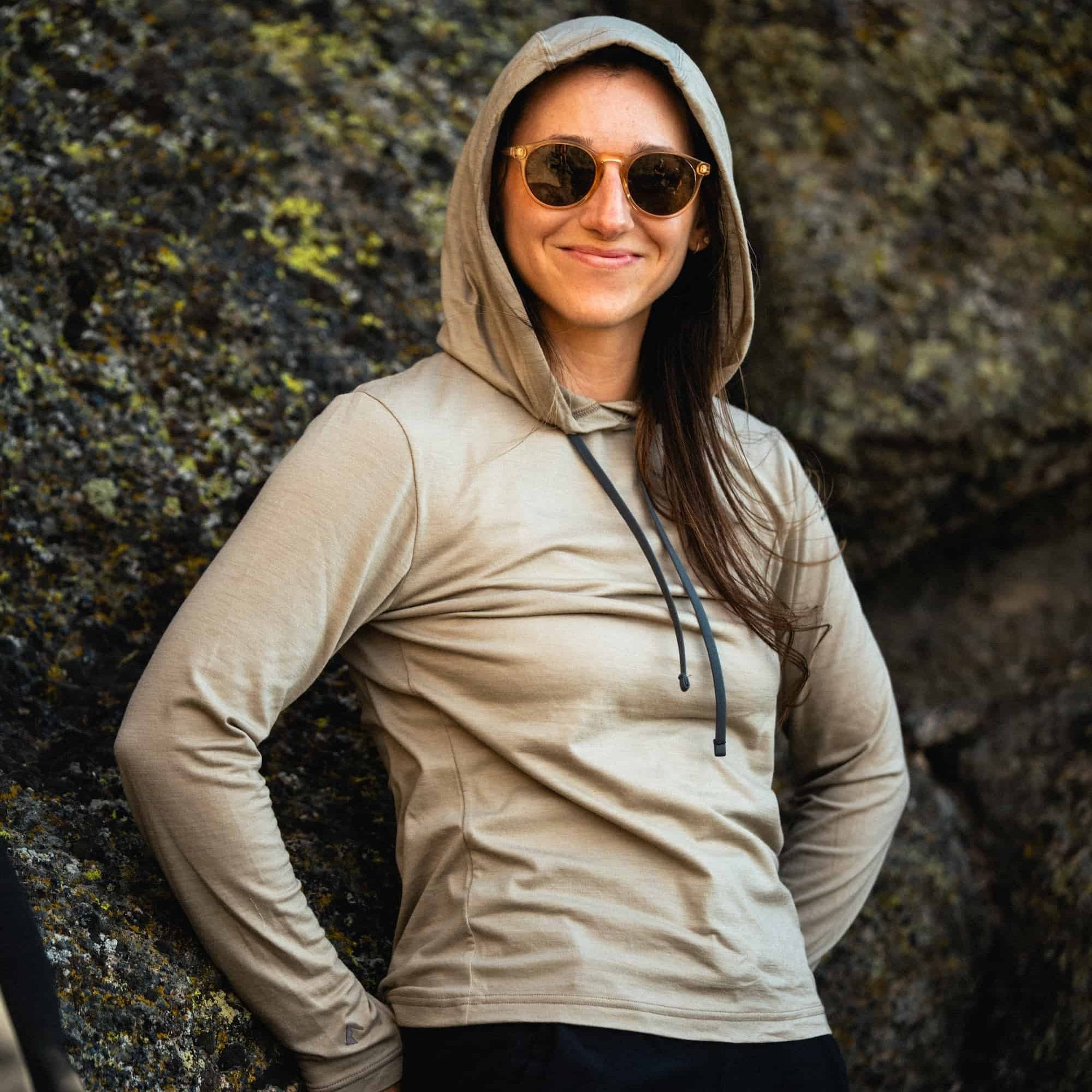 a woman wearing a Driftwood Solstice Sun Hoodie