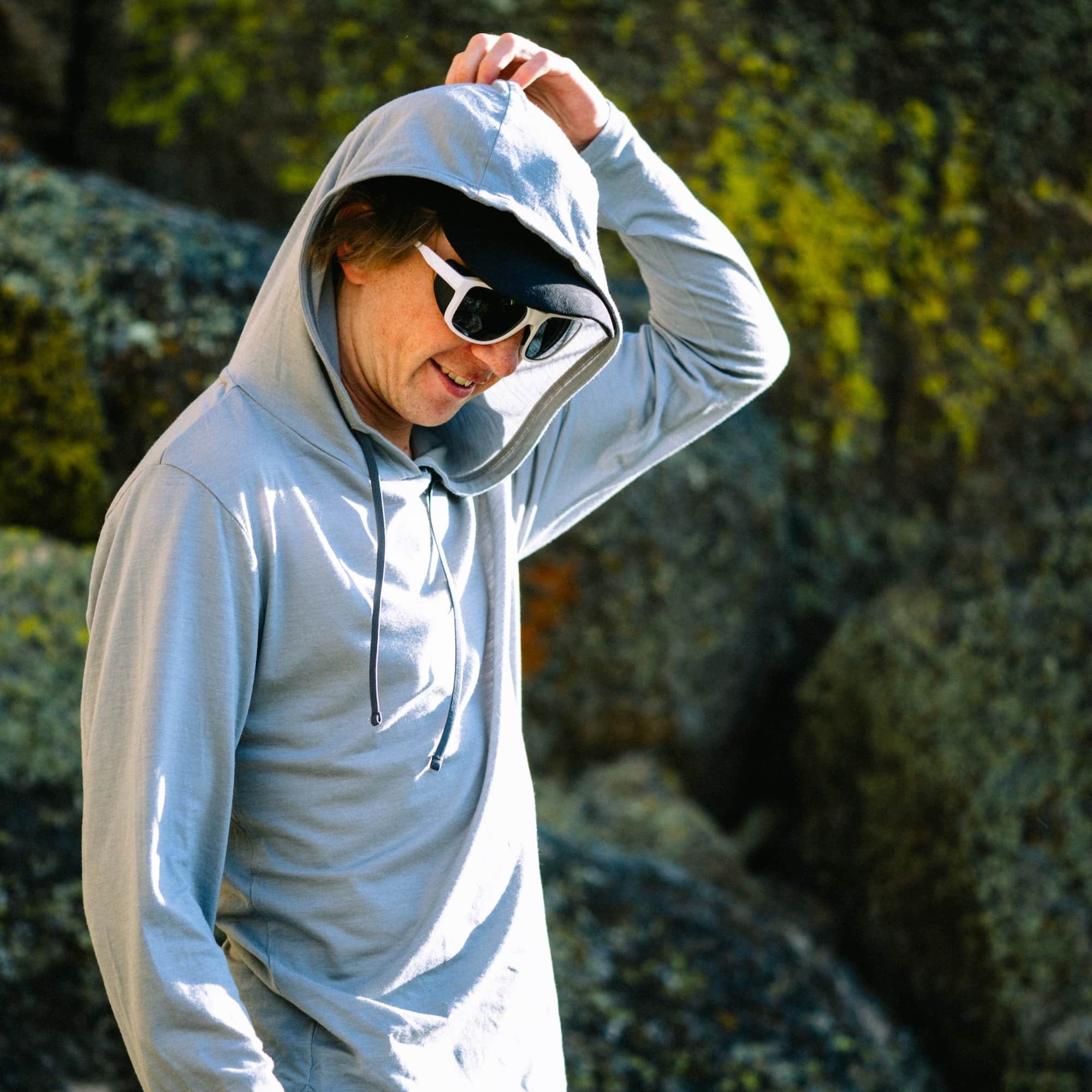 the giant, flowy hood of the Solstice Sun Hoodie in Sierra Cement