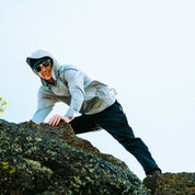 a man wearing a Ridge Merino Solstice Sun Hoodie