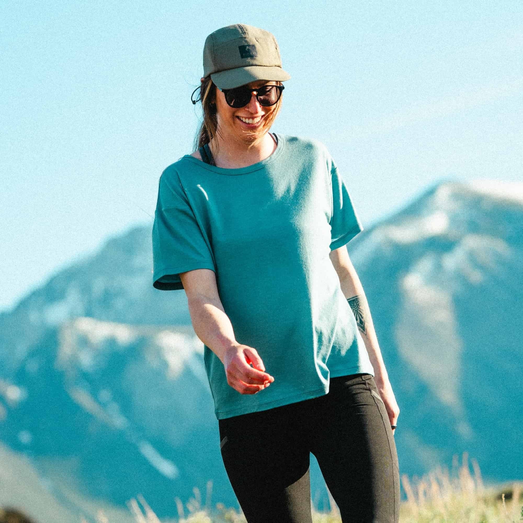 a woman walking in a Wander Relaxed Fit Tee in Smoke Blue