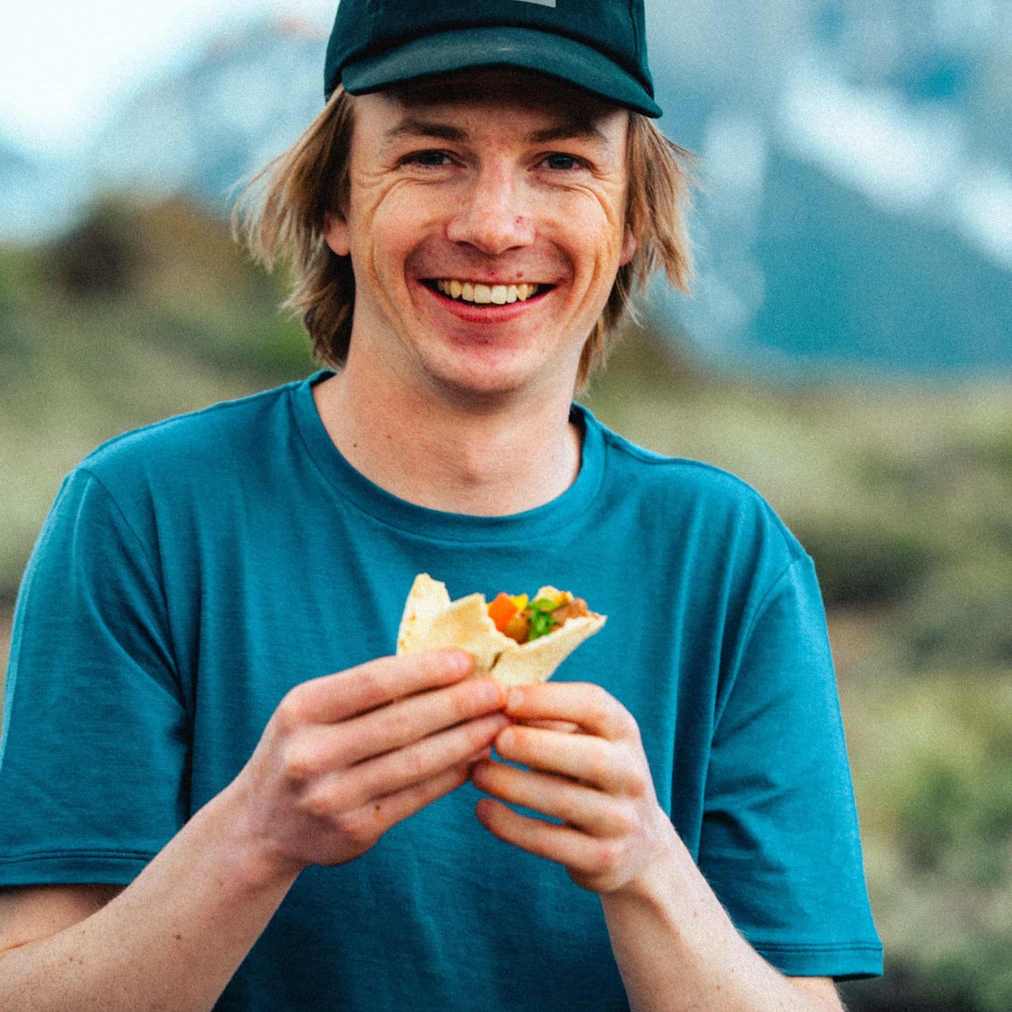 a man wearing a Ridge Journey Merino Wool Tee in Vintage Indigo