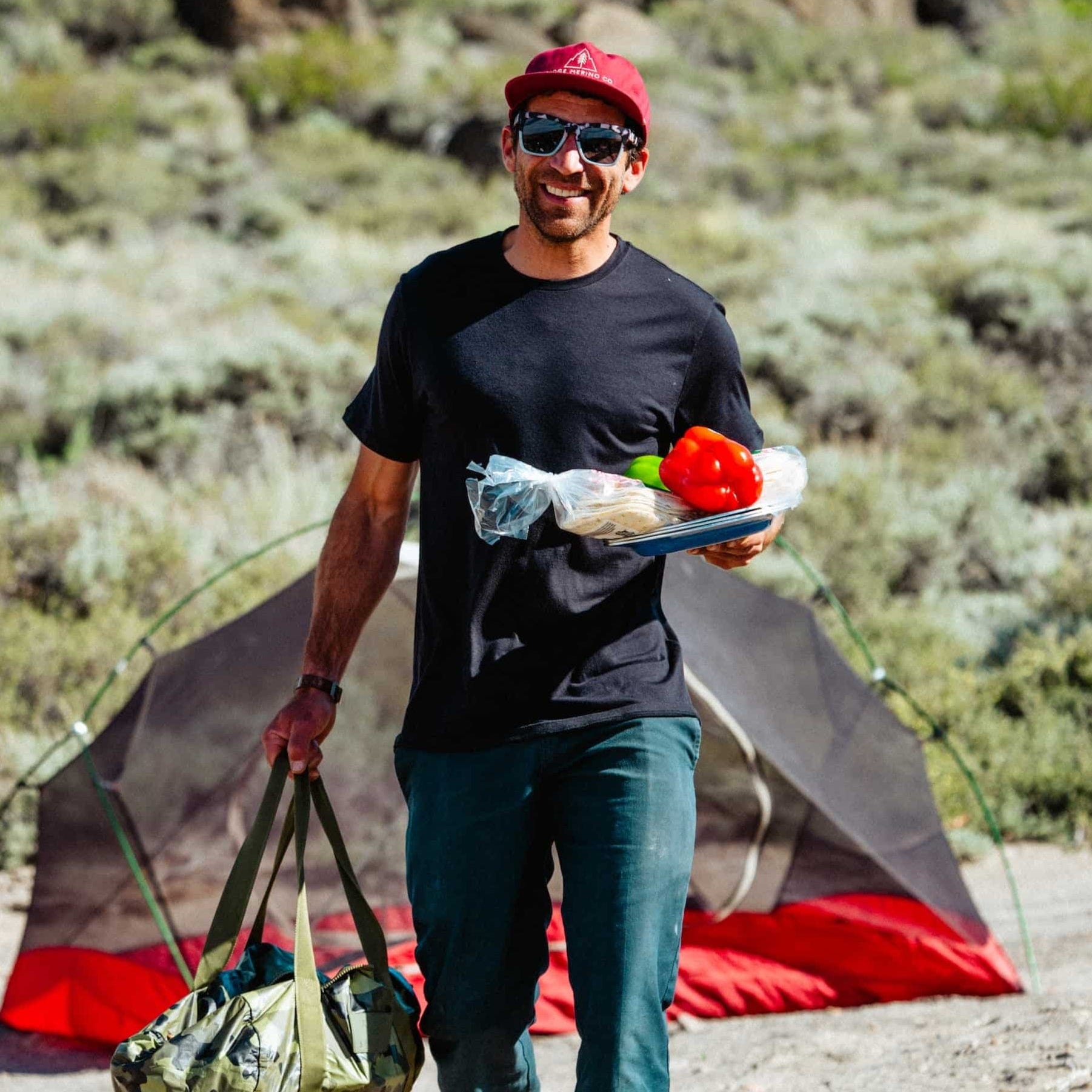 a man on a camping trip wearing a Journey Merino Wool T-shirt