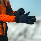 a woman putting on Tioga Tour Gloves