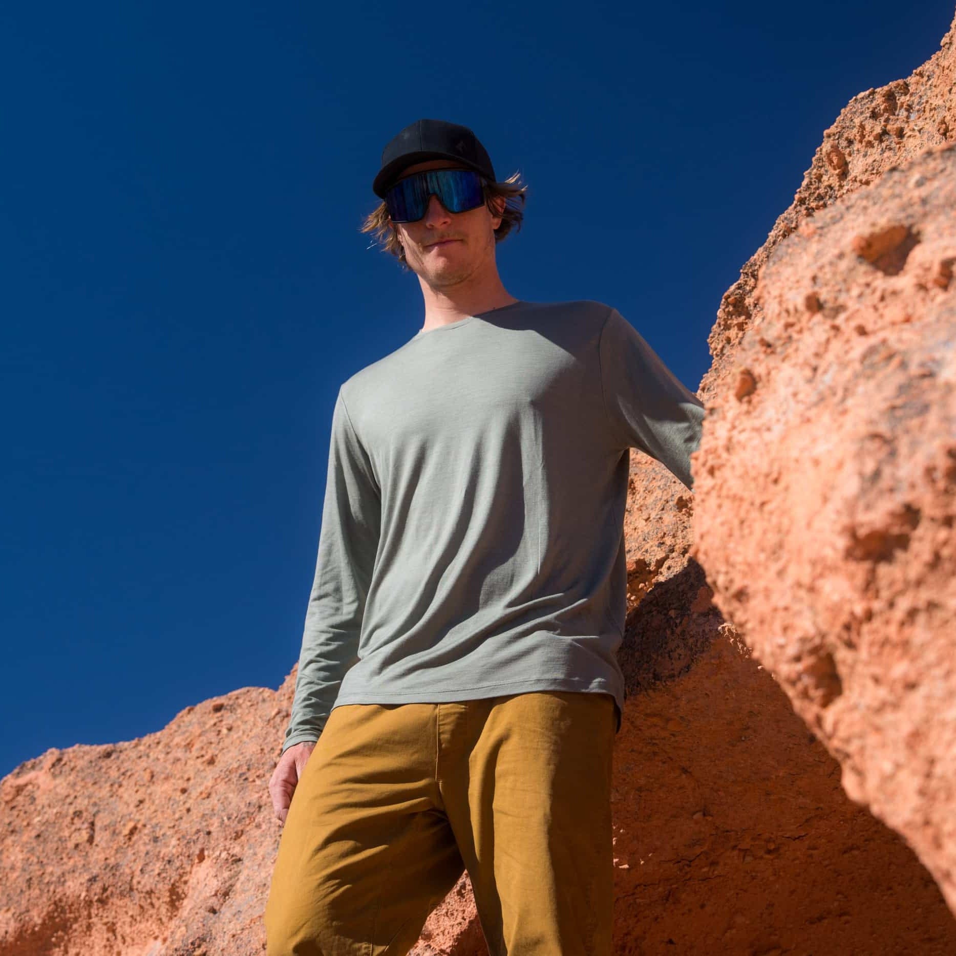 a man wearing a Merino Tencel long sleeve shirt on a hike