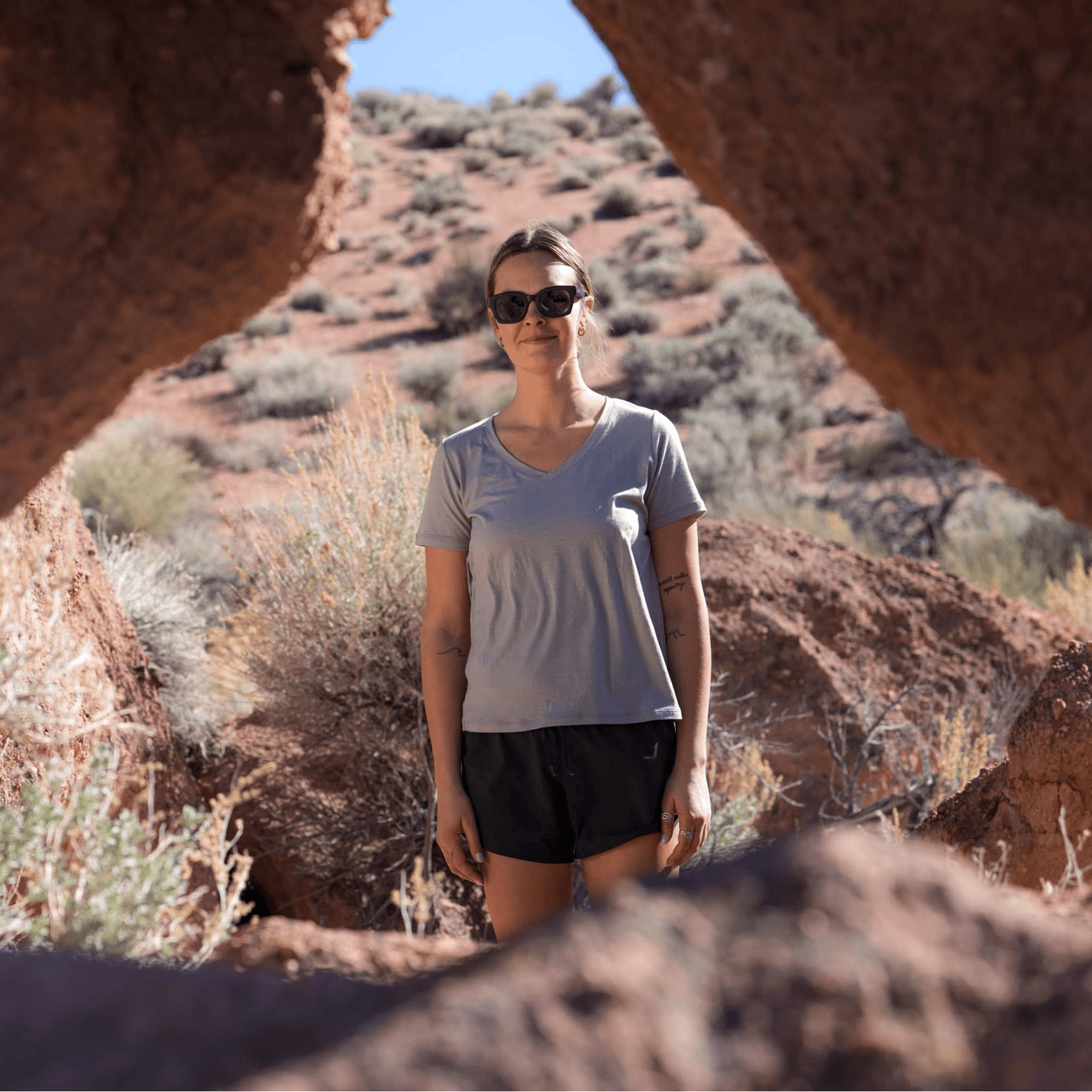 a woman wearing a v-neck Merino wool t-shirt