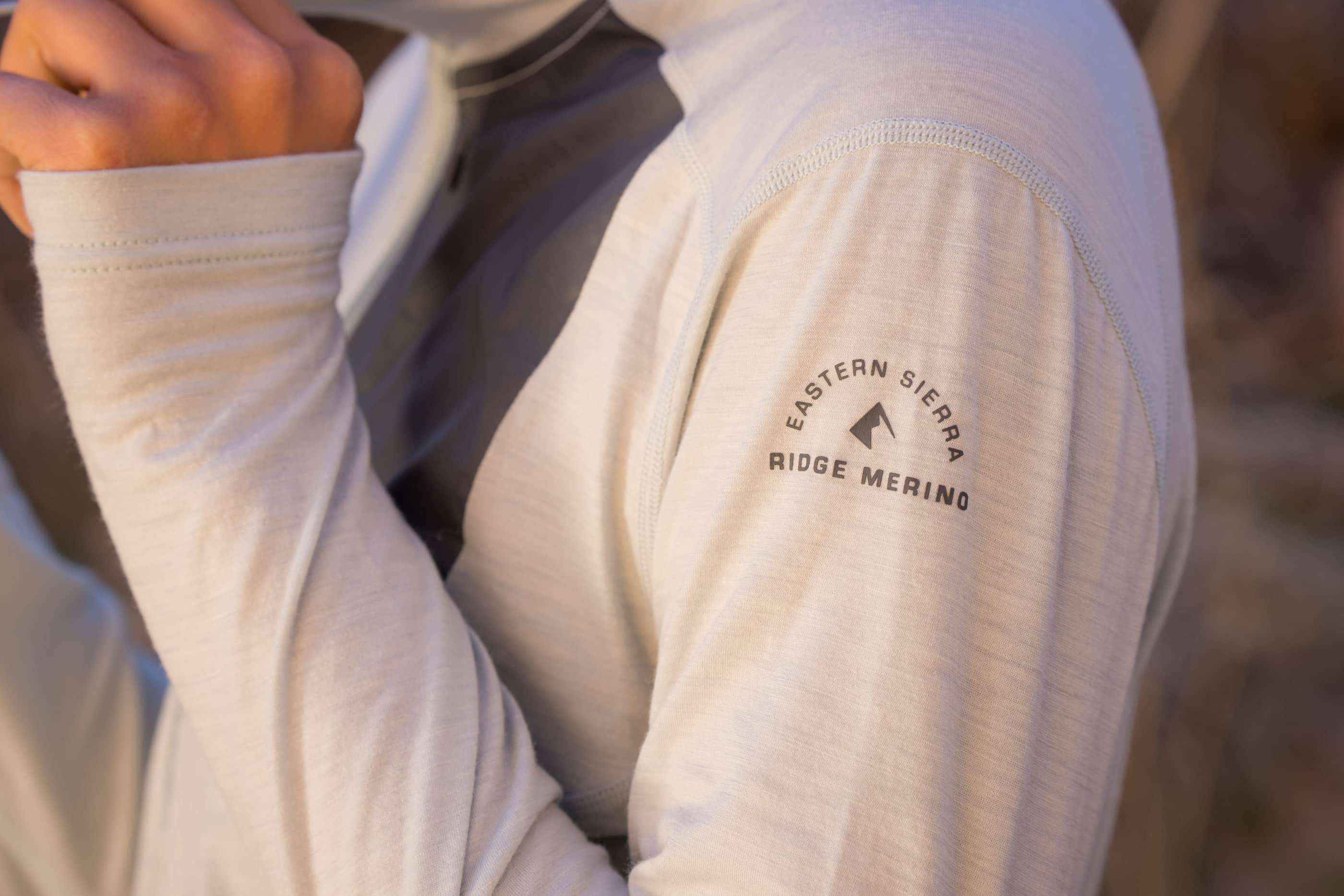 closeup of Ridge Merino logo on the Solstice Pro Sun Hoodie
