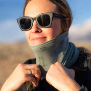a woman wearing a backpacker print Sierra Neck Tube