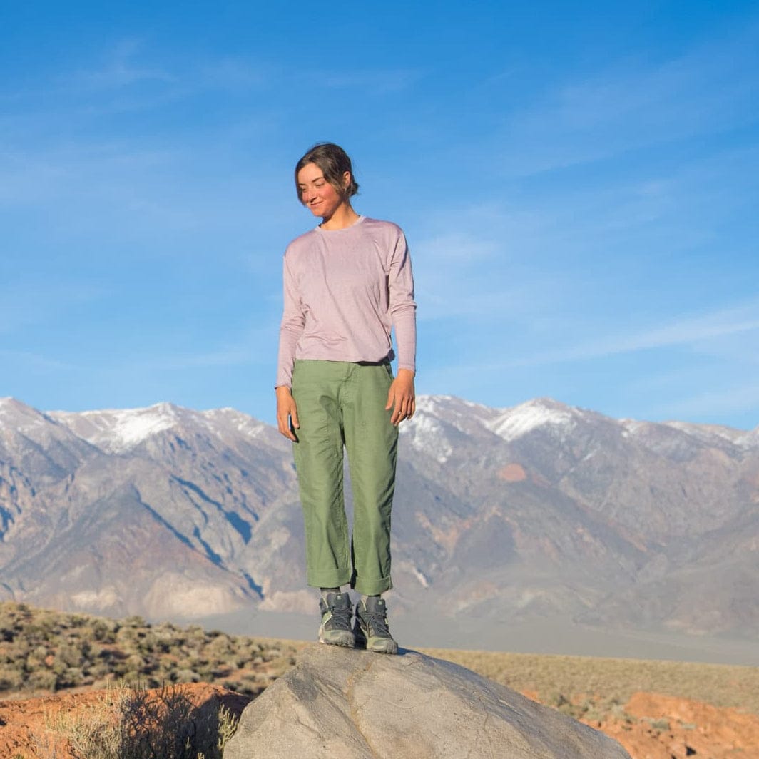 a woman wearing a pink Canopy Long Sleeve Shirt on a hike