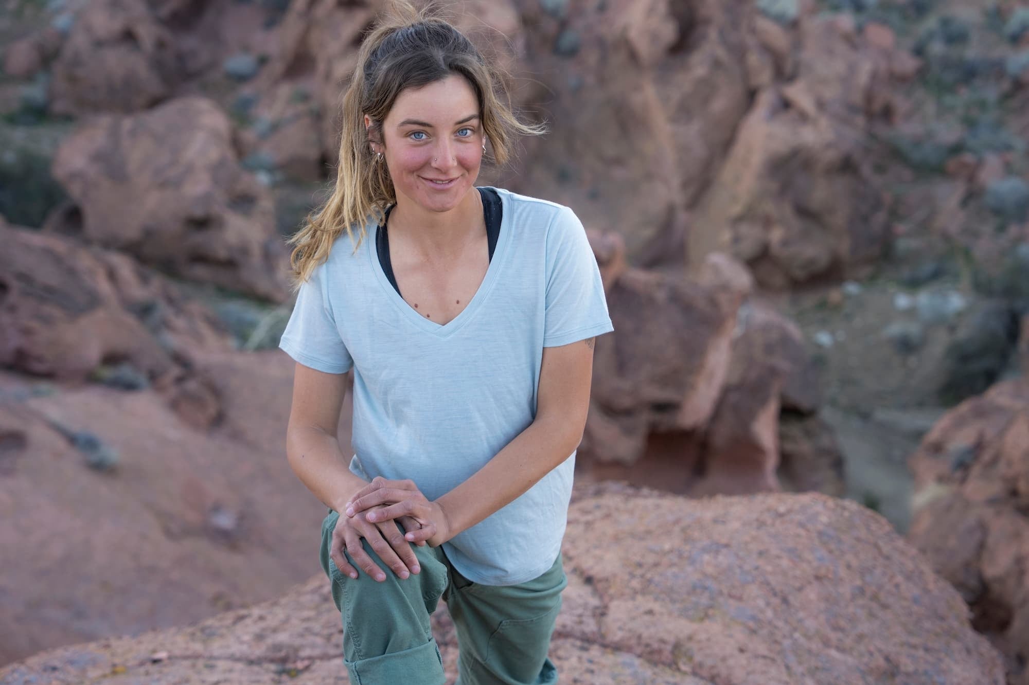 a woman kneeling wearing a Ridge Merino V-Neck T-Shirt