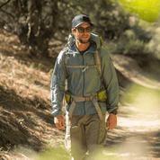 a backpacker wearing a Windshifter Windbreaker