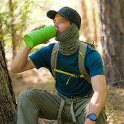 a man drinks from his water bottle wearing a Sierra Merino Wool Neck Tube