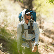 a backpacker wearing a Solstice Pro Sun Hoodie