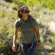 a woman hiking wearing a Journey Merino T-Shirt