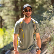 a man hiking in a Journey Merino Wool V-Neck