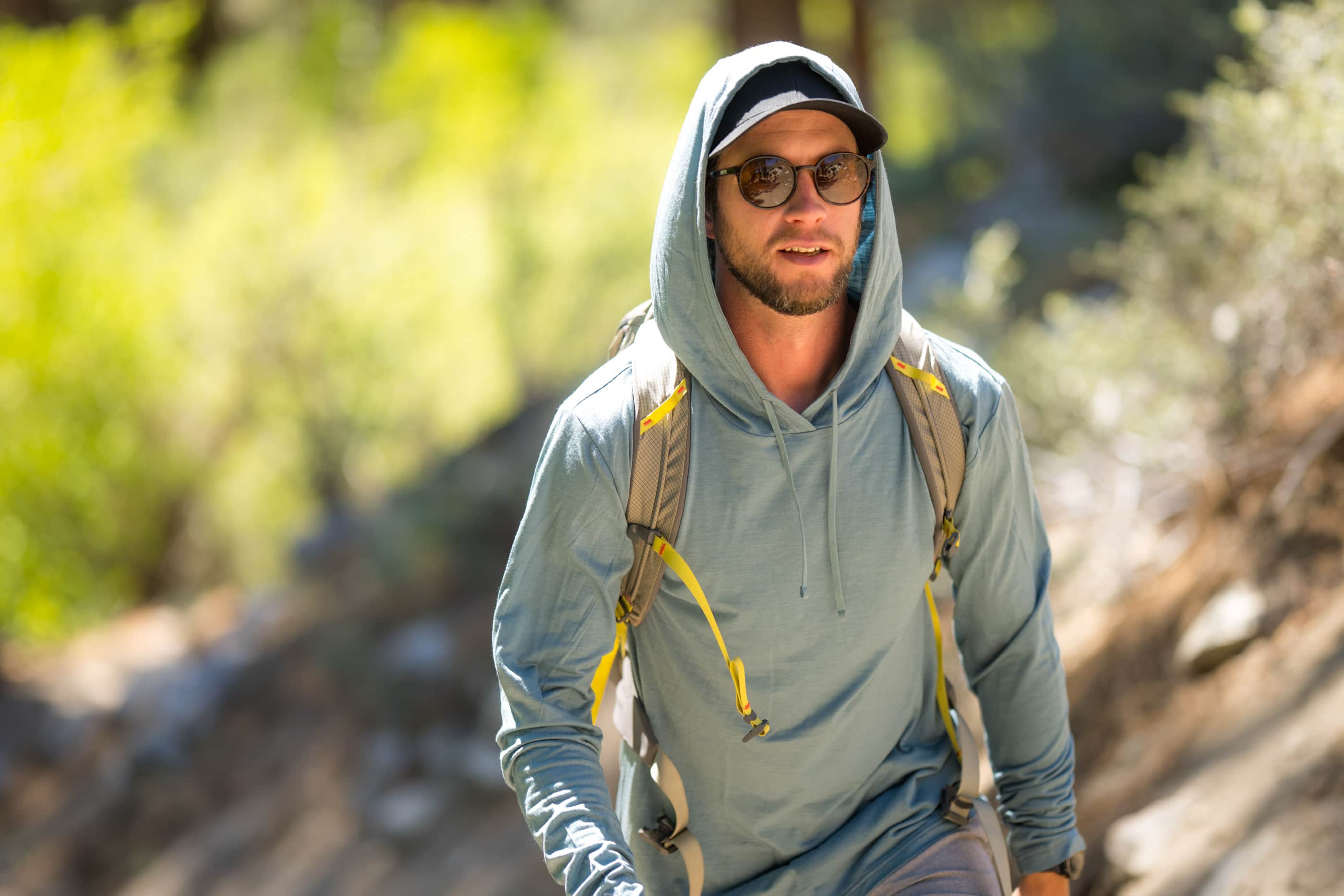 a hiker wearing a Solstice Sun Hoodie