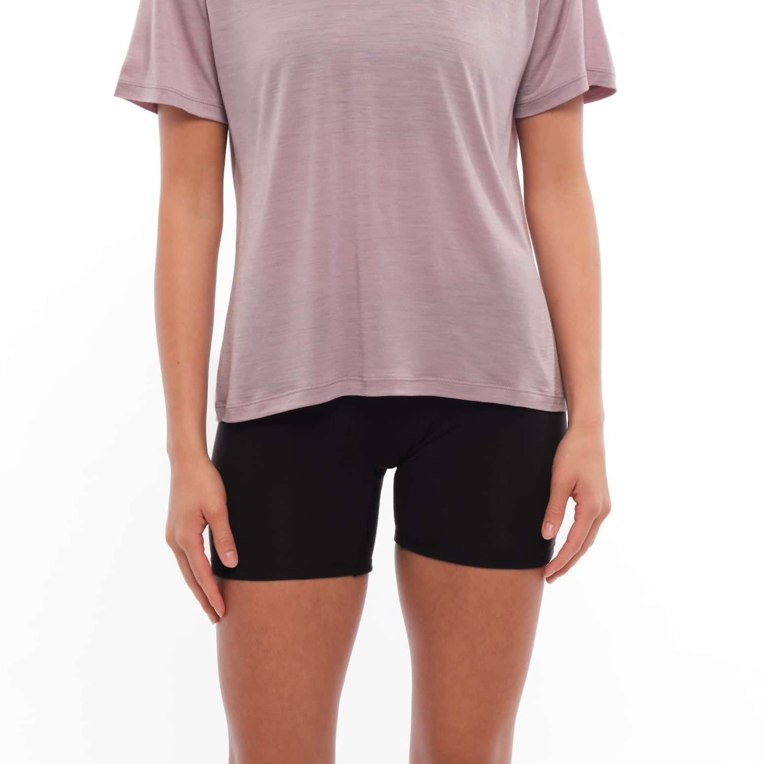 a woman wearing a Ridge Merino t-shirt with long Boy shorts in Black