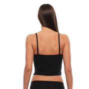a woman wearing a black Merino wool bralette from the back