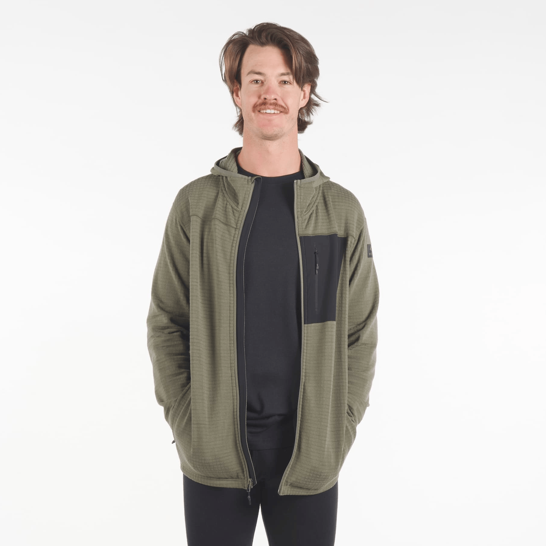 man wearing a Cloudripper full zip grid fleece hoodie in green with black pocket unzipped