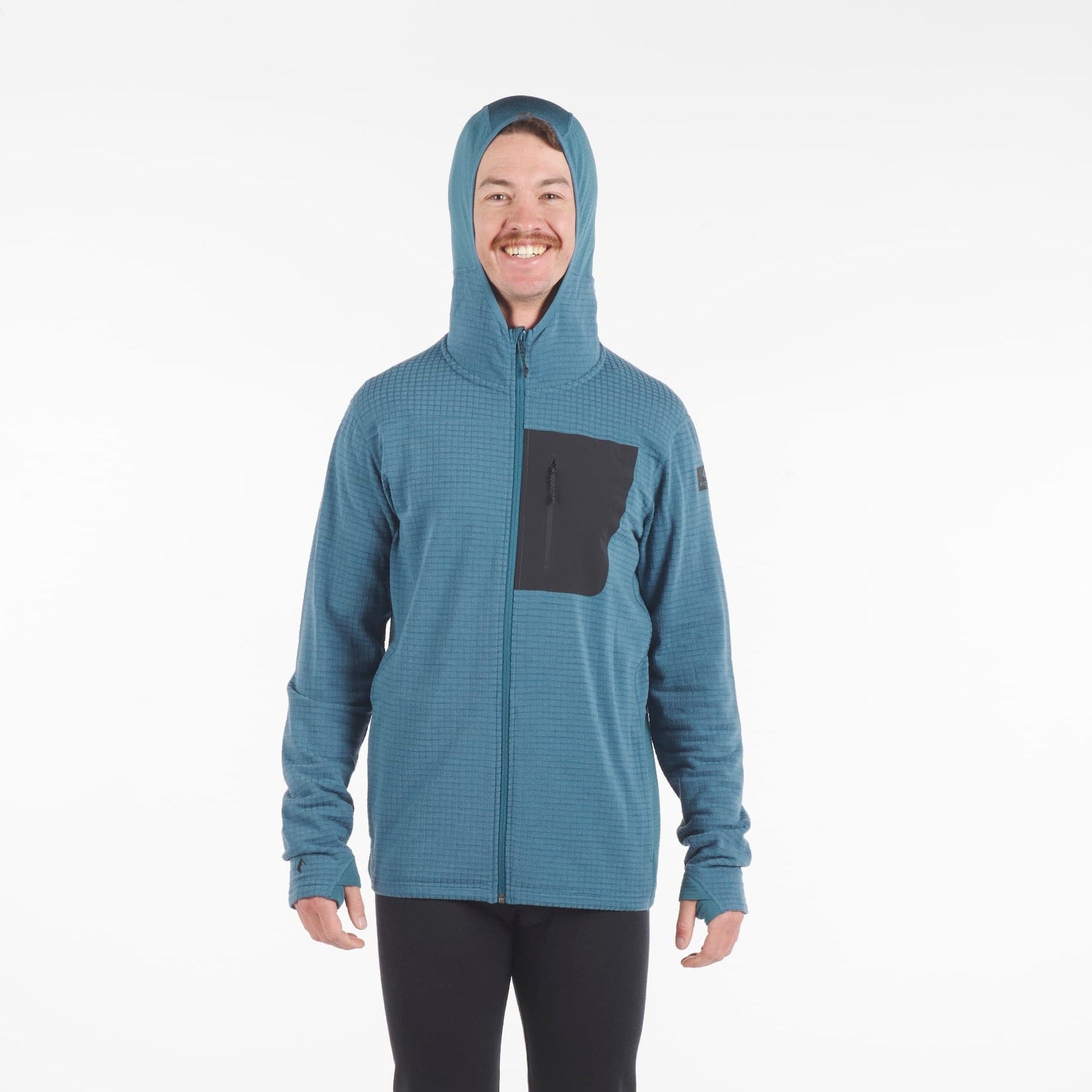man wearing a Cloudripper full zip grid fleece hoodie in blue with a black pocket with hood zipped up