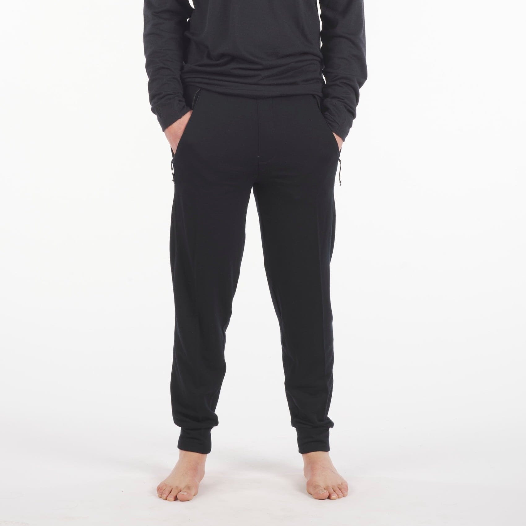 man in black Ridge Merino 100% Merino Hyde Joggers and an Aspect Long Sleeve Shirt