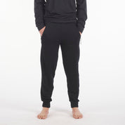 man in black Ridge Merino 100% Merino Hyde Joggers and an Aspect Long Sleeve Shirt