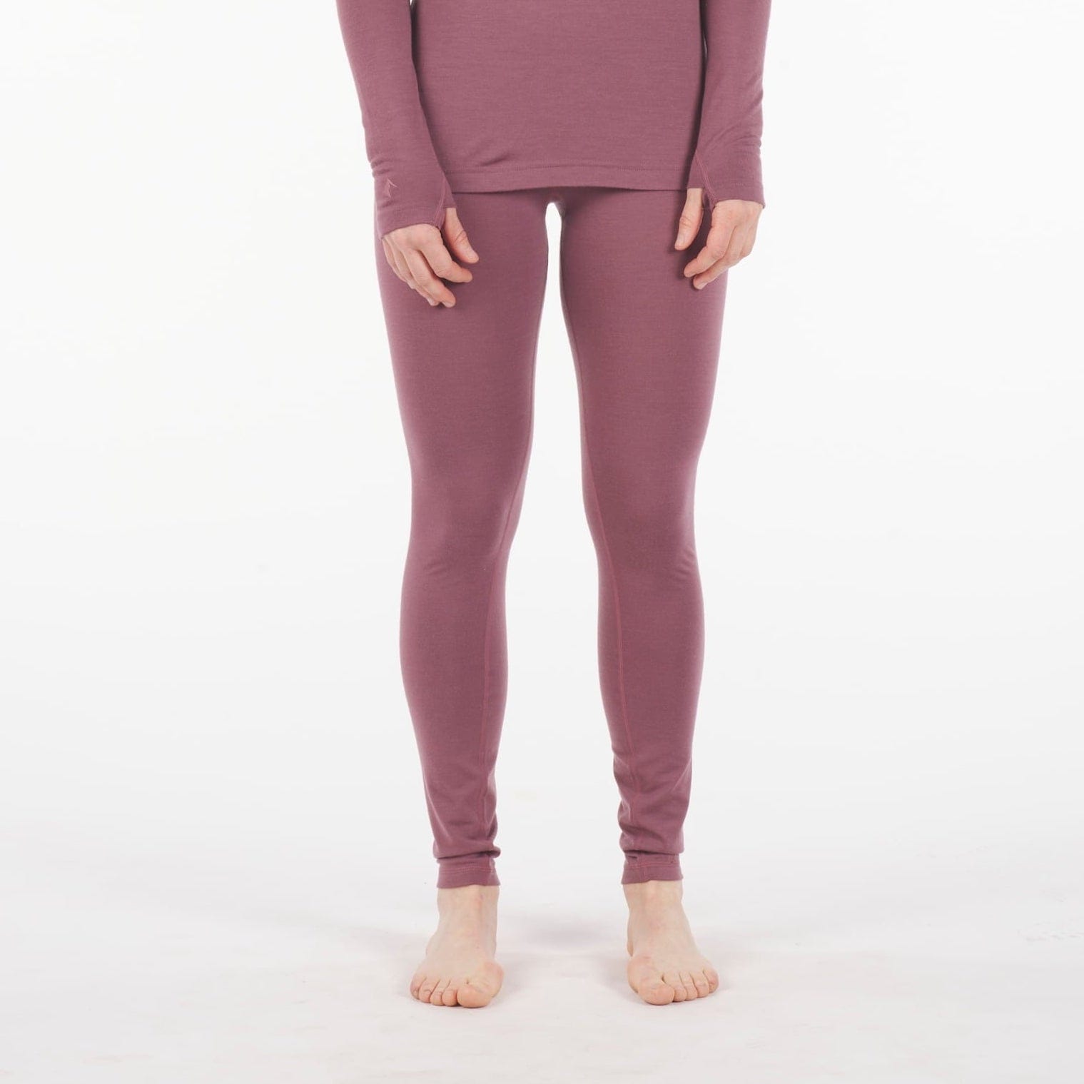 a woman wearing High Rise Aspect Base Layer Bottoms in Soft Plum with a matching Aspect shirt