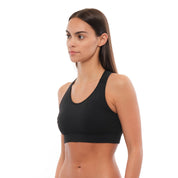 a woman wearing a Ridge Merino Wool Sports Bra