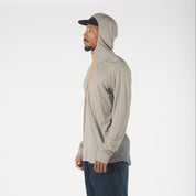 a man wearing a Pursuit Air Hoodie in tan with the hood up