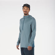 a man wearing a Pursuit Air Hoodie with the zipper up