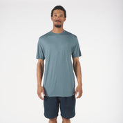 a man wearing a blue Pursuit Air Merino Mesh T-shirt