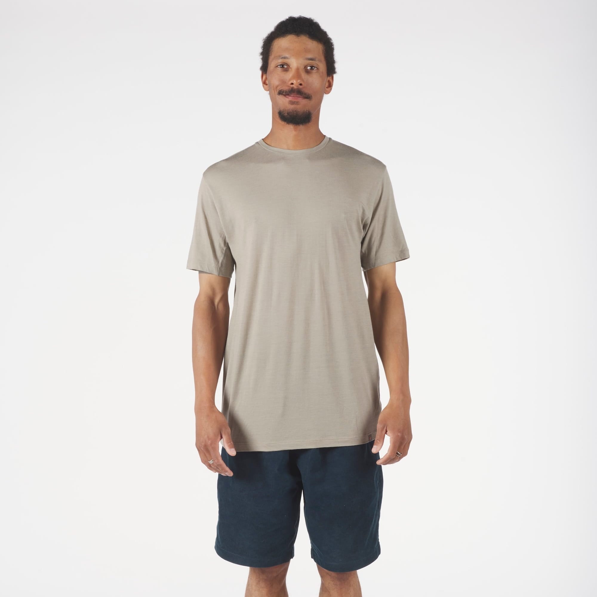 a man wearing a Rock Ridge Pursuit Merino Ultralight T-shirt