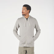 a man wearing a Ridge Merino Traveler Hoodie in Rock Ridge