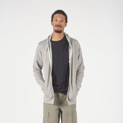 a man wearing a Men's Traveler Hoodie in Rock Ridge with a black Journey Pocket Tee underneath