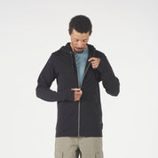 a man wearing a Ridge Merino Traveler Hoodie in black with a blue shirt underneath