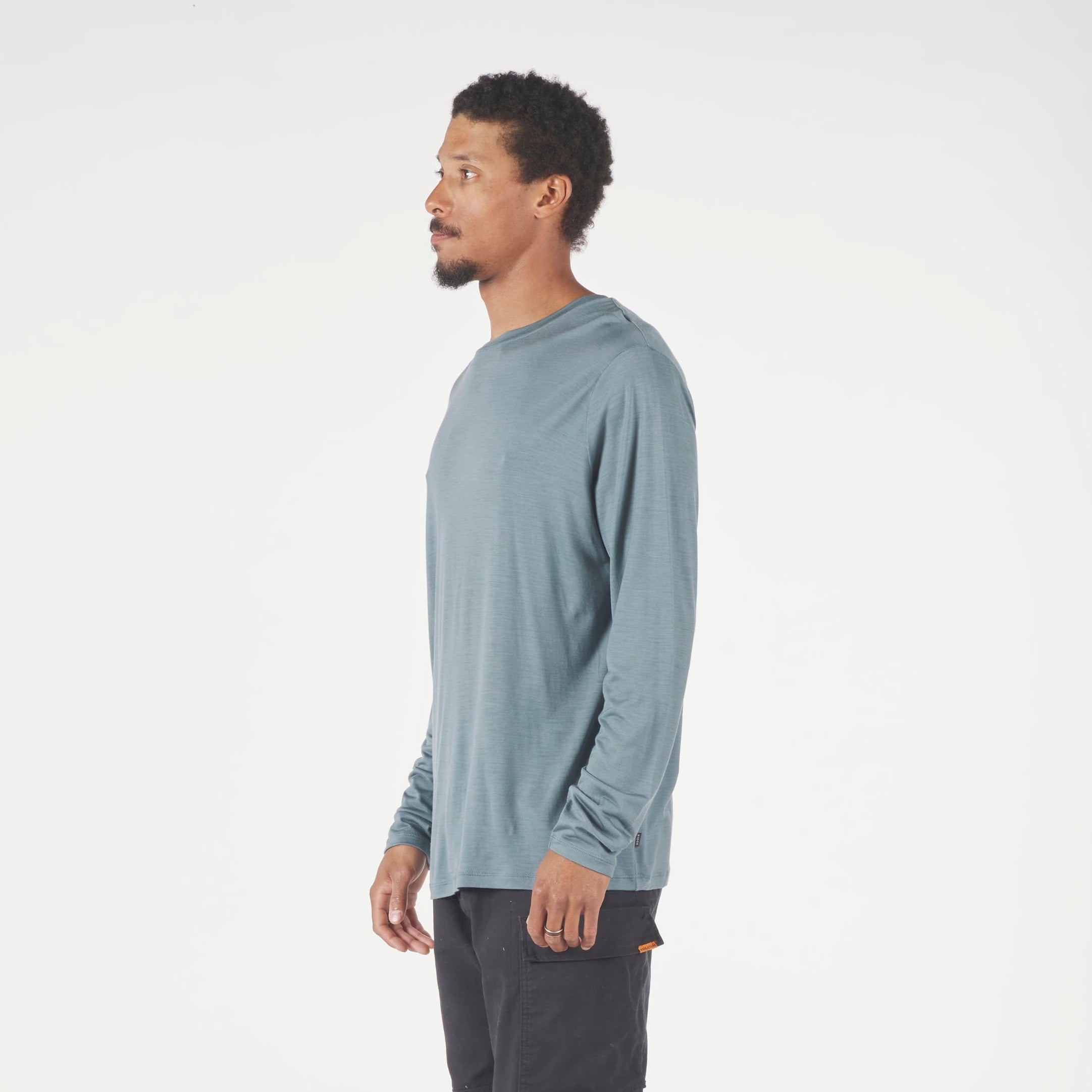 A man wearing a long sleeve Canopy Shirt in Overcast Blue