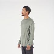 A man wearing a long sleeve Canopy Shirt in Agave Green