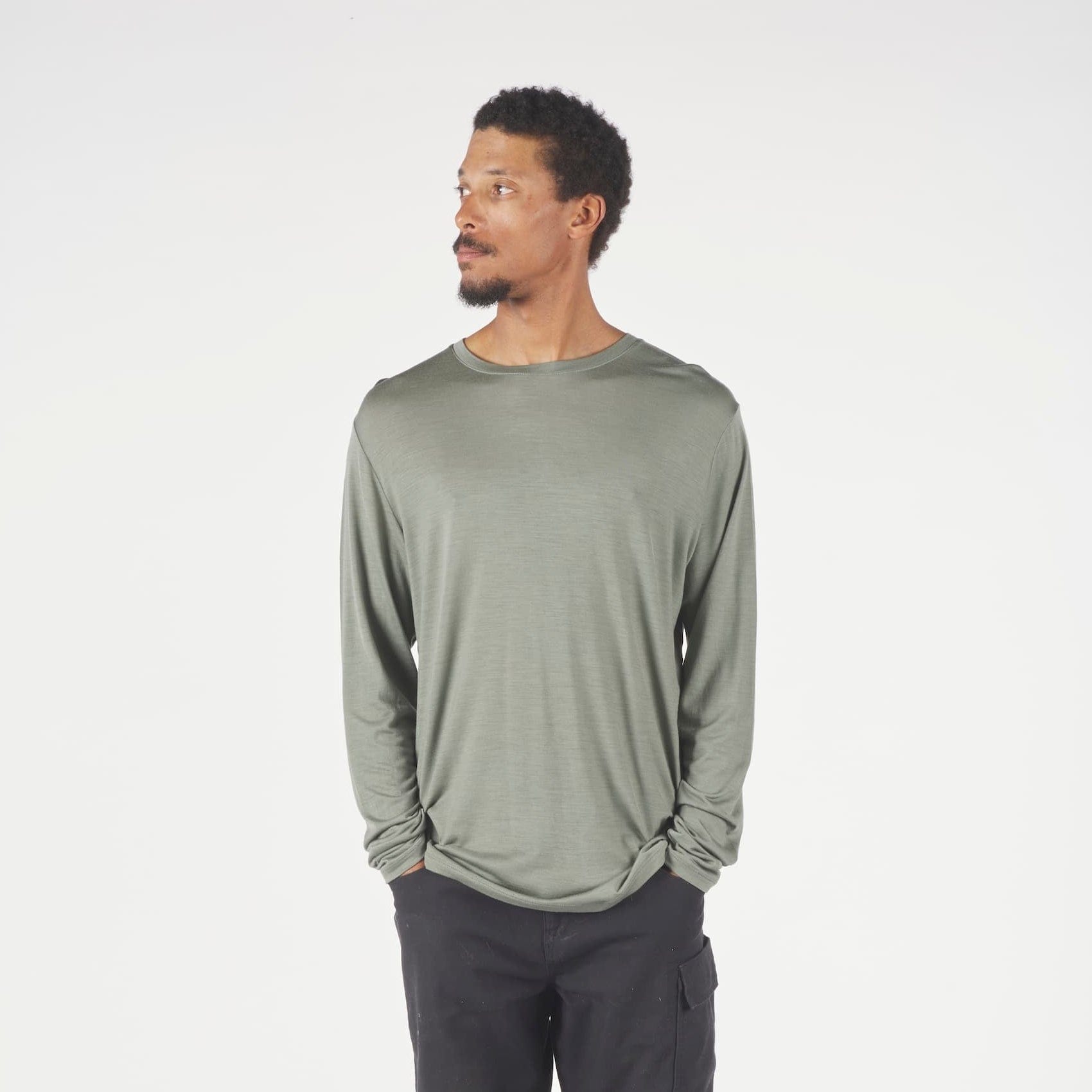 A man wearing a long sleeve Canopy Shirt in Agave Green
