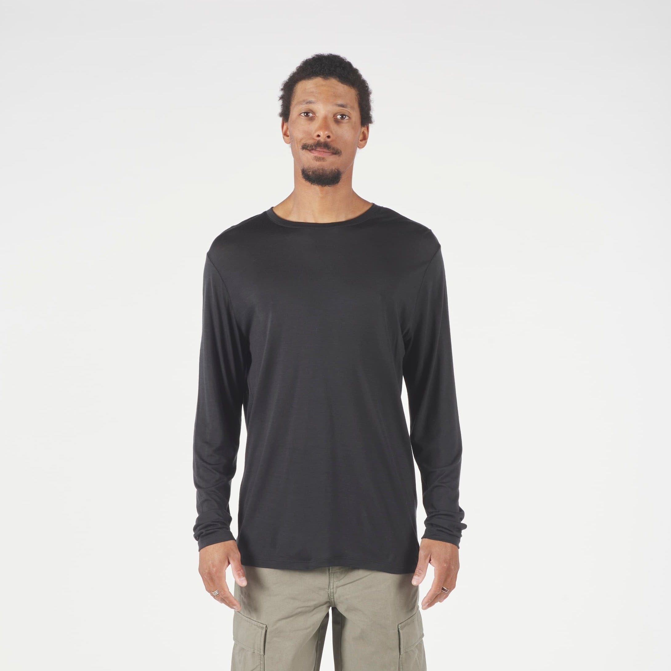 A man wearing a long sleeve Canopy Shirt in Black