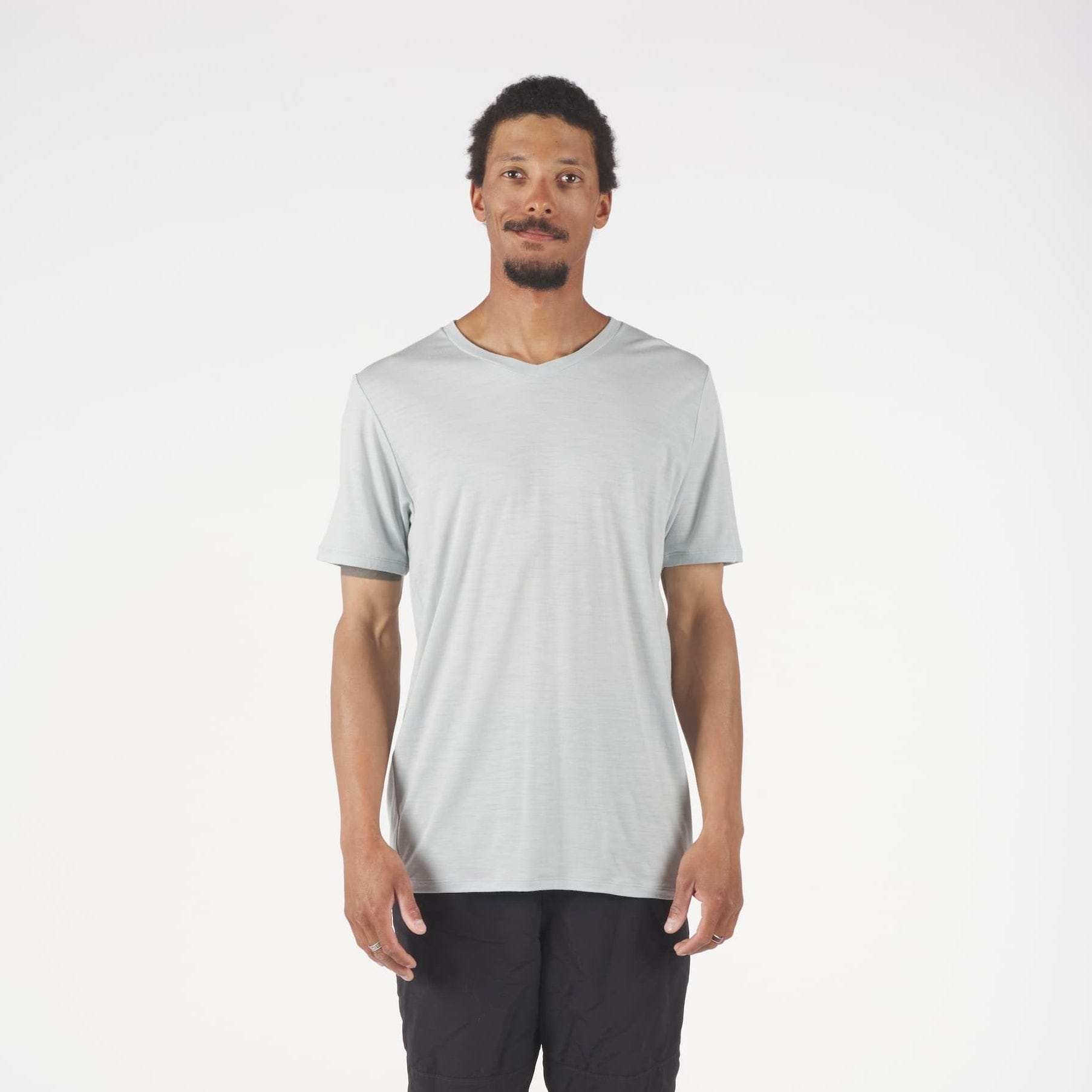 a man wearing a gray Journey V-Neck Merino Wool T-shirt