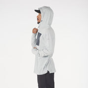 a man wearing a Solstice Pro Merino Wool Sun Hoodie in Ice Flow