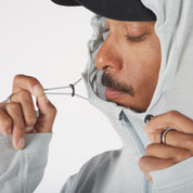 a closeup of the hood cinch on the Solstice Pro Merino Wool Sun Hoodie