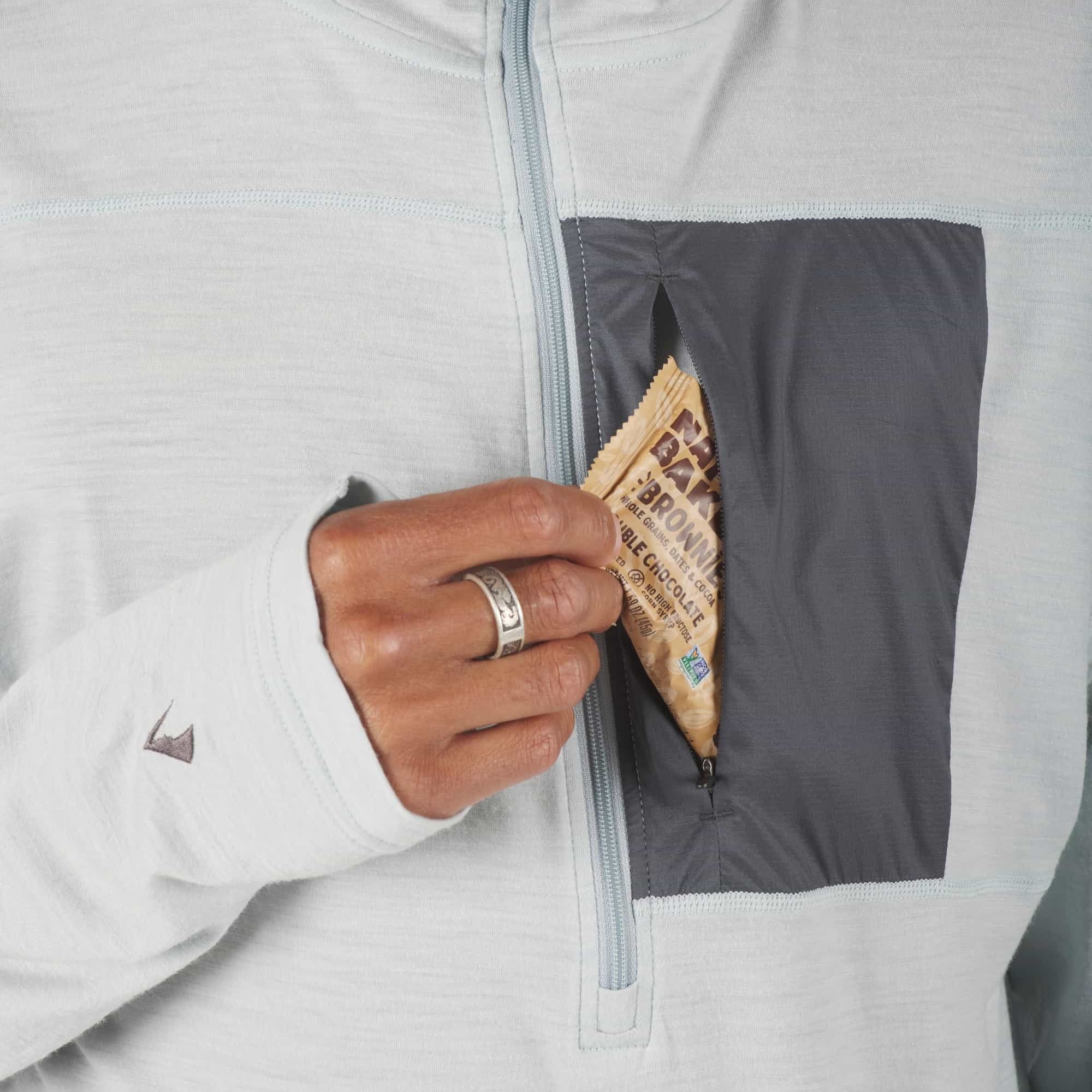 a closeup of the zipper chest pocket on the Solstice Pro Merino Wool Sun Hoodie