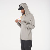 a man wearing a tan Solstice Merino Wool Sun Hoodie