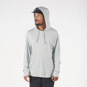 a man wearing a Ridge Run Hat and an Ice Flow Solstice Merino Wool Sun Hoodie