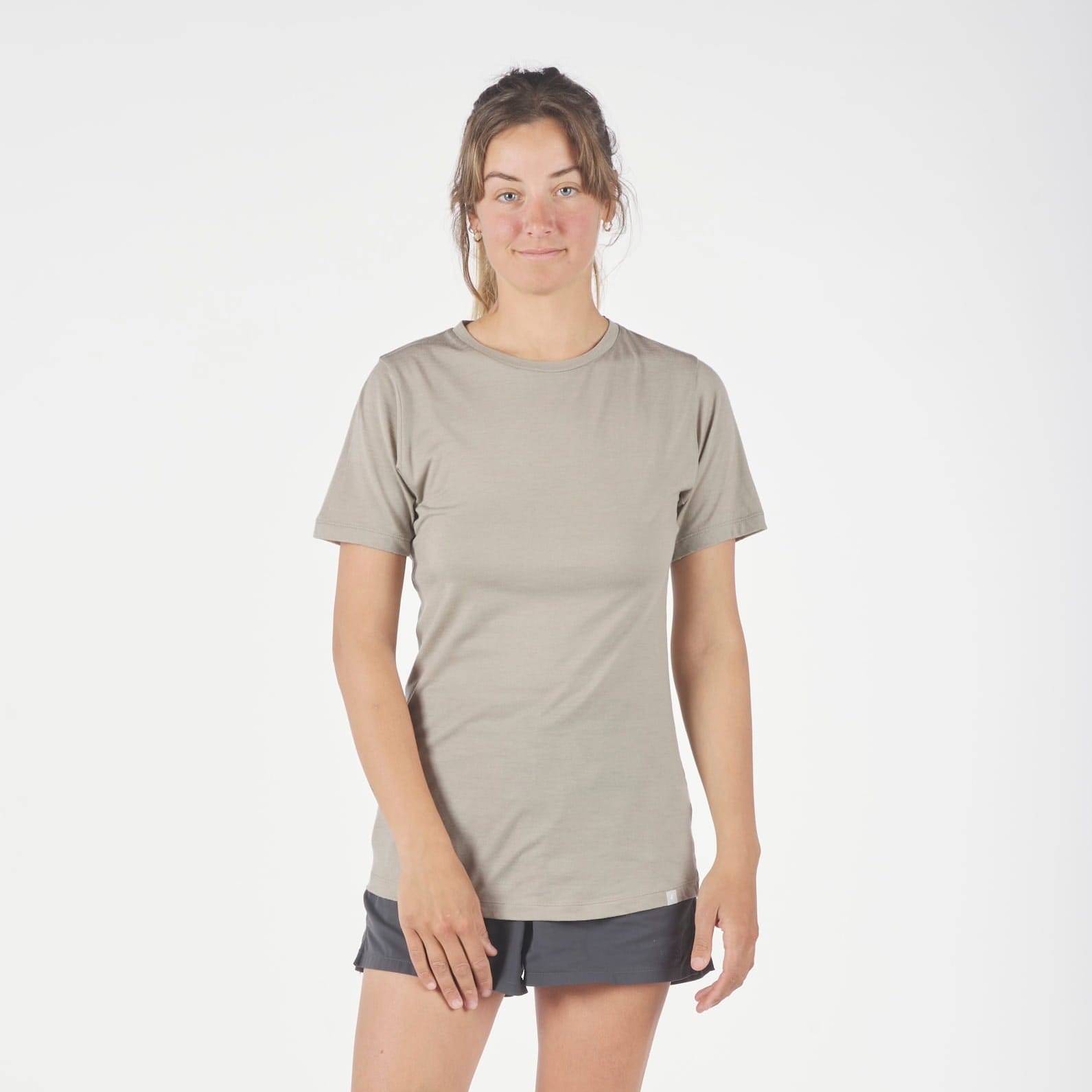 a runner wearing a Pursuit T-Shirt in Rock Ridge with running shorts