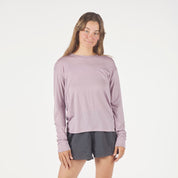 a woman wearing a Dusty Lilac Canopy Long Sleeve Merino Tencel Shirt