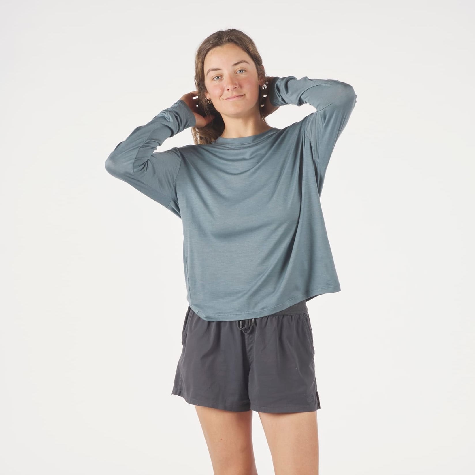 a woman wearing a blue Canopy Long Sleeve Merino Tencel Shirt