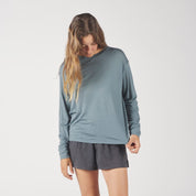 a woman wearing a blue Canopy Long Sleeve Merino Tencel Shirt